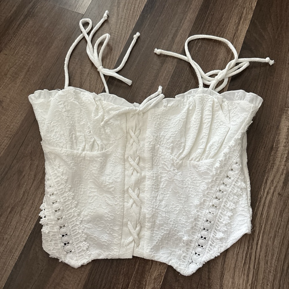 Kirious crop top size S. Adjustable tie up strap